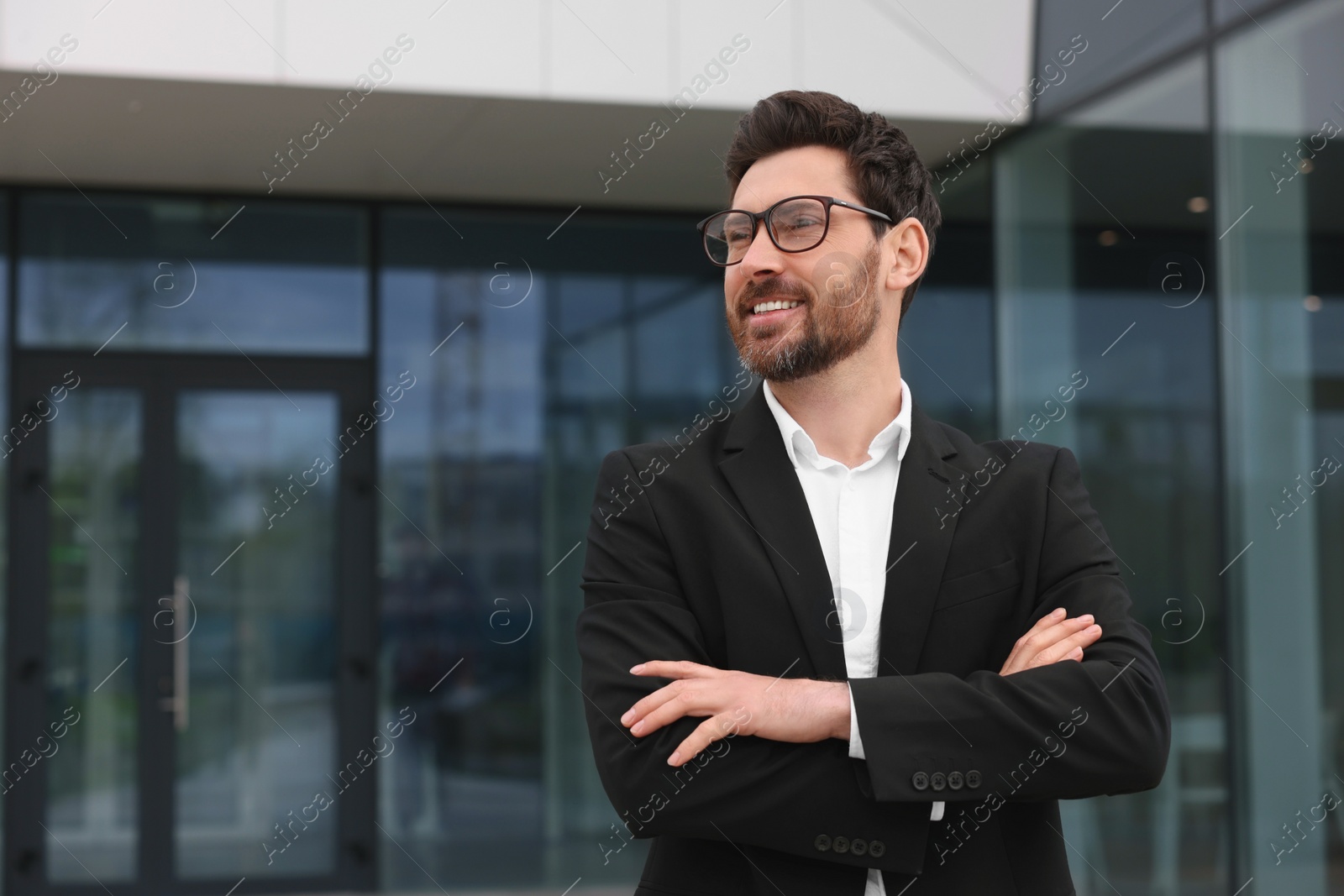 Photo of Happy real estate agent outdoors. Space for text