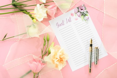 Guest list, pen, tulle fabric and beautiful flowers on pink background, flat lay. Space for text