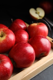 Fresh ripe red apples on table, closeup