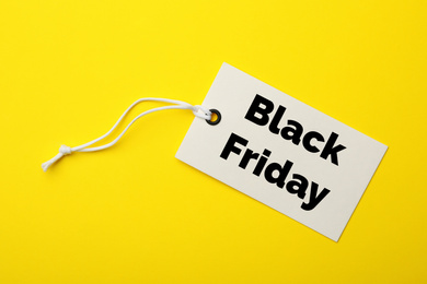 Image of Tag with text BLACK FRIDAY on yellow background, top view