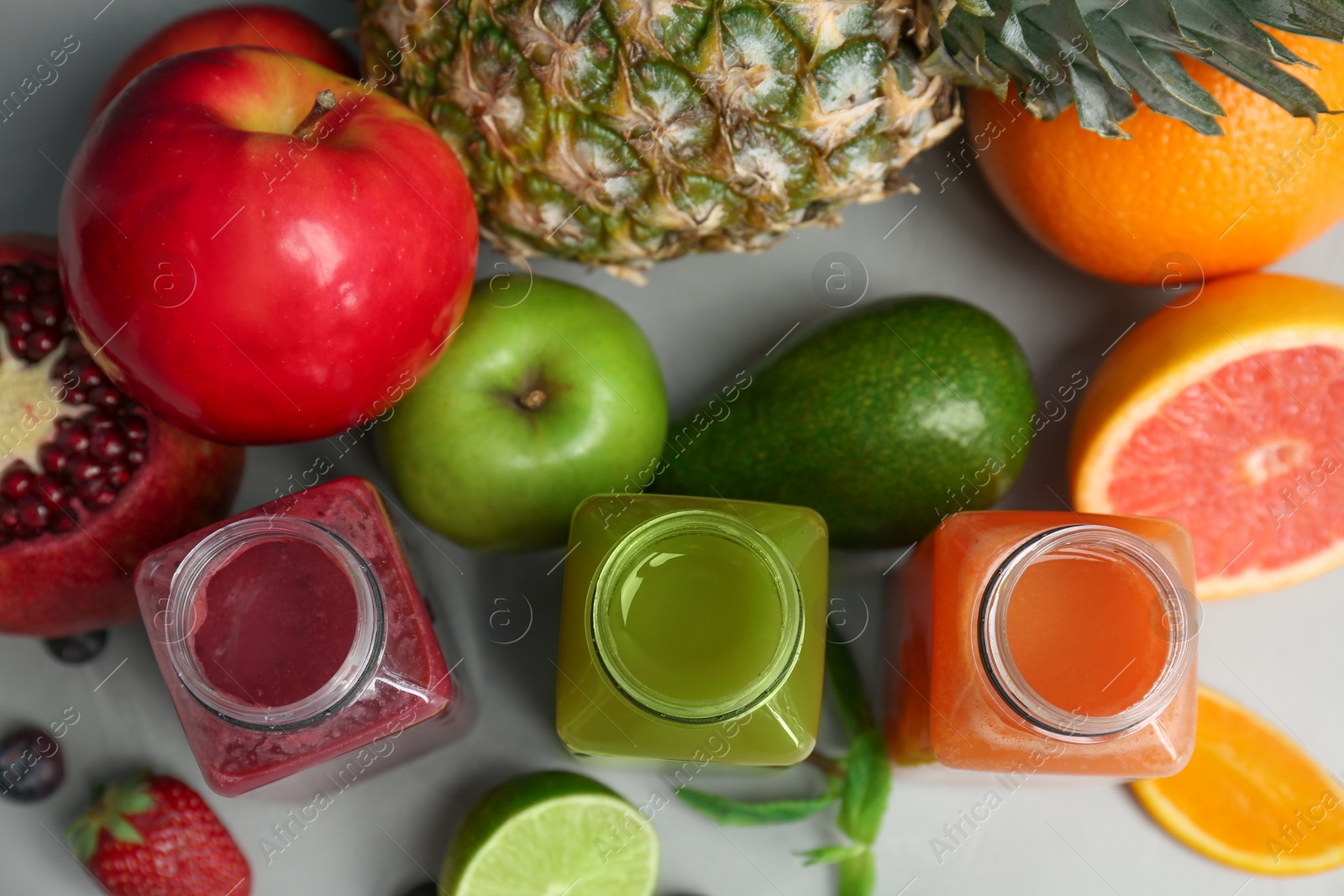 Photo of Flat lay composition with healthy detox smoothies and ingredients on table