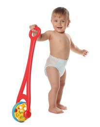 Cute baby with push toy learning to walk on white background
