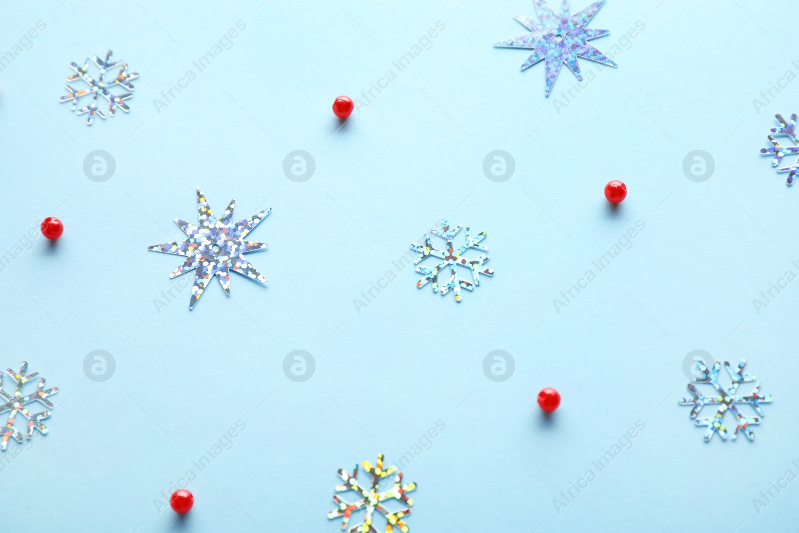 Photo of Flat lay composition with Christmas decorations on light blue background