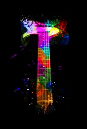 Image of Bright colorful design with electric guitar on black background, closeup. Rock music concept