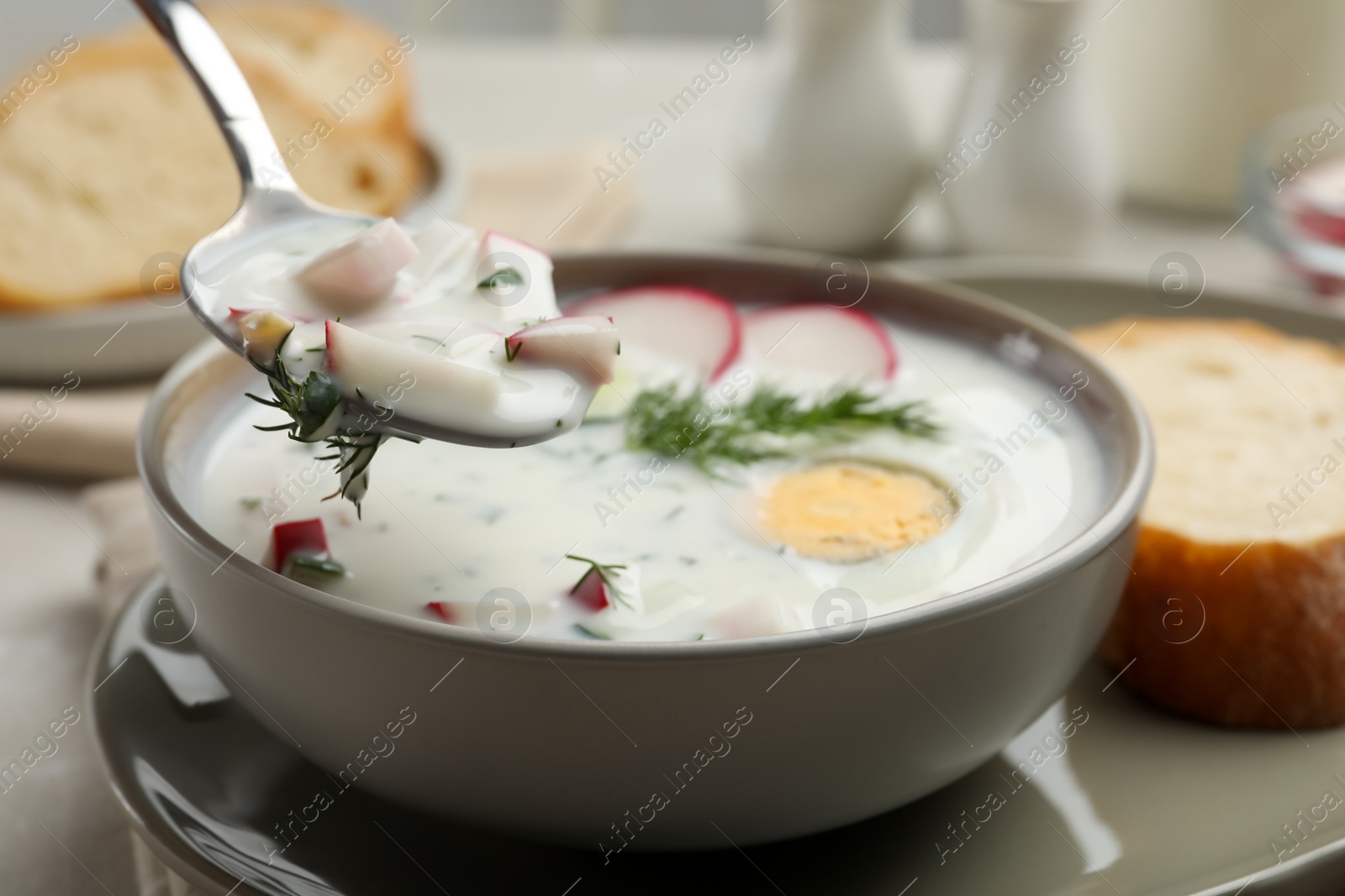 Photo of Eating delicious cold summer soup, closeup view