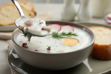 Photo of Eating delicious cold summer soup, closeup view