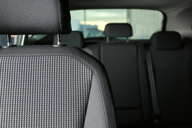 Photo of Car seat with grey upholstery, closeup view