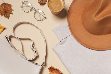 Flat lay composition with stylish hat on beige background