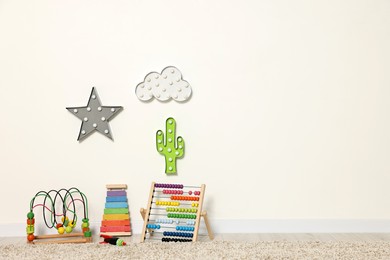 Educational toys and nightlights in beautiful children's room. Space for text