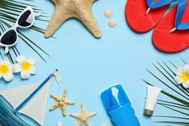 Flat lay composition with beach accessories on color background, space for text