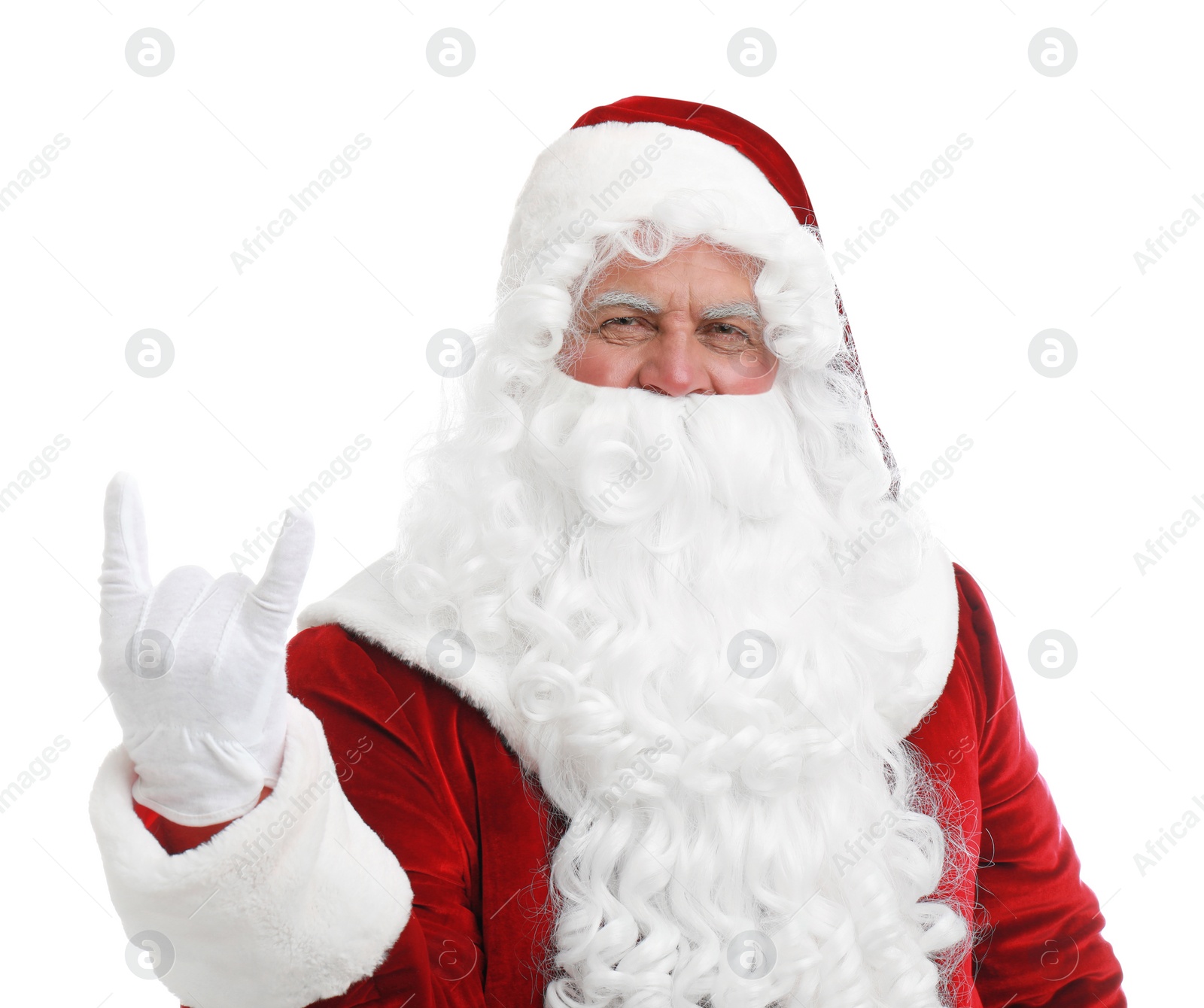 Photo of Funny Santa Claus showing rock gesture on white background. Christmas time