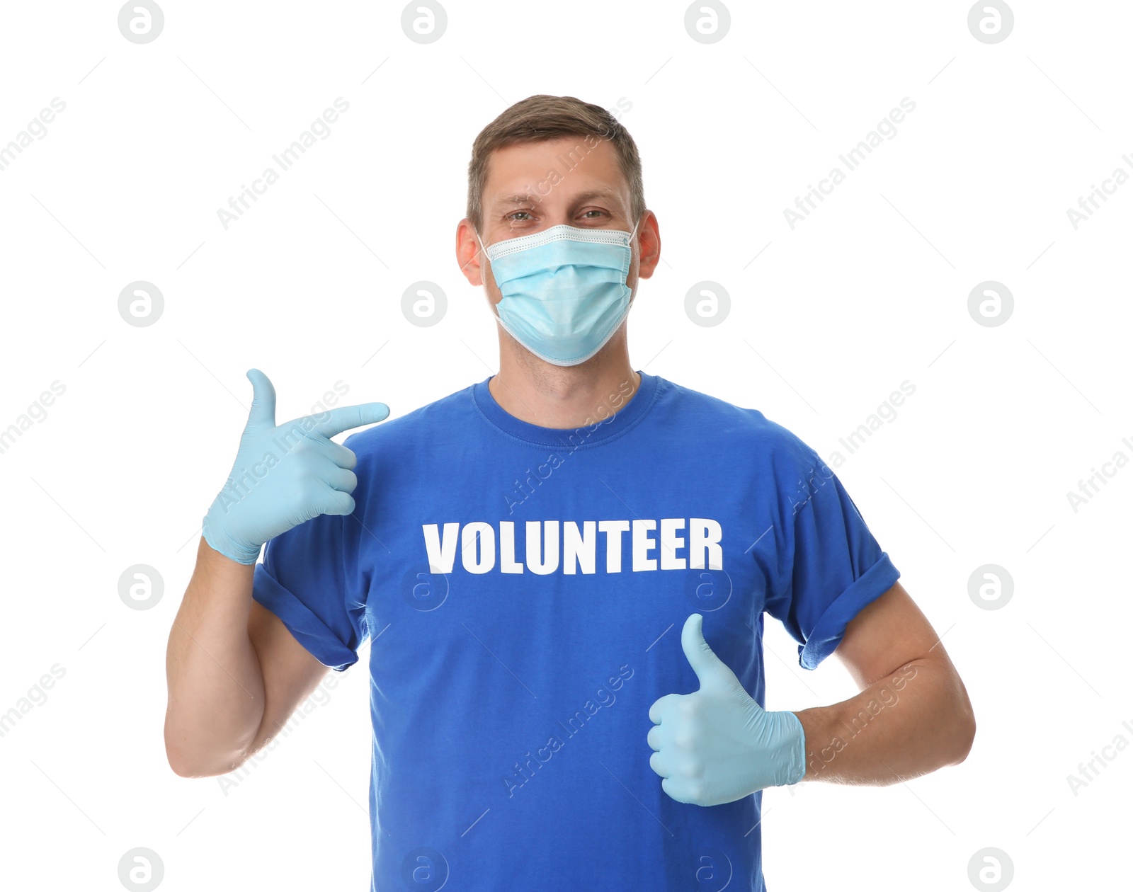Photo of Male volunteer in mask and gloves on white background. Protective measures during coronavirus quarantine
