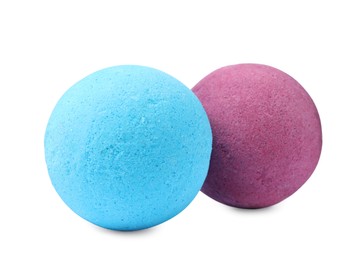 Photo of Two bright bath bombs on white background