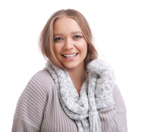Young woman in warm sweater, mittens and scarf on white background. Winter season