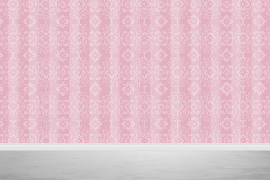 Image of Pink wallpaper and grey floor in room