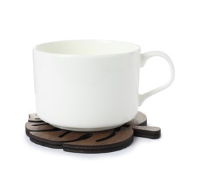 Leaf shaped wooden coaster and cup on white background