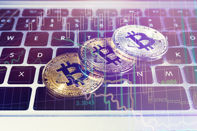 Image of Golden and silver bitcoins on computer keyboard