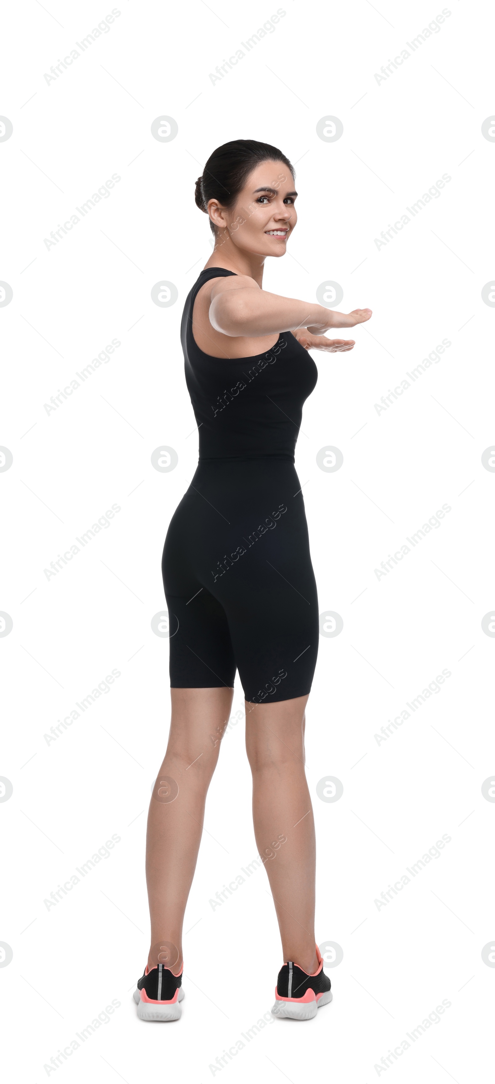 Photo of Happy woman doing morning exercise on white background