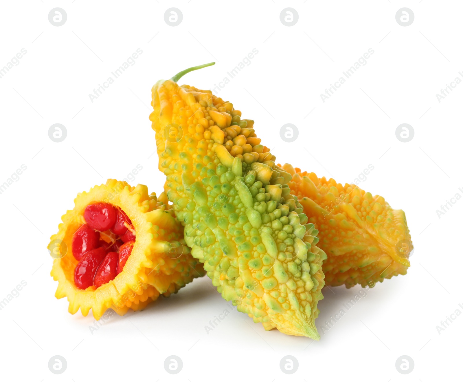 Photo of Fresh ripe bitter melons on white background