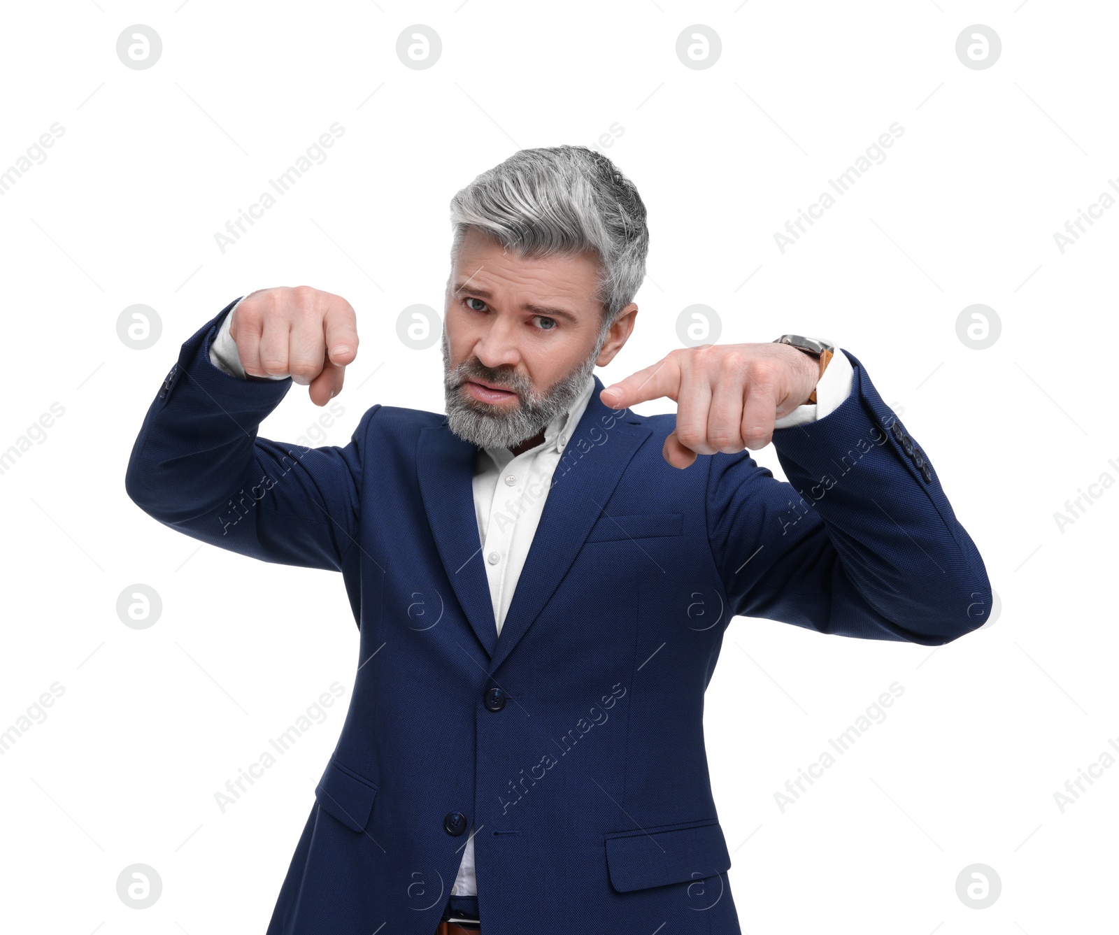 Photo of Mature businessman in stylish clothes posing on white background, low angle view