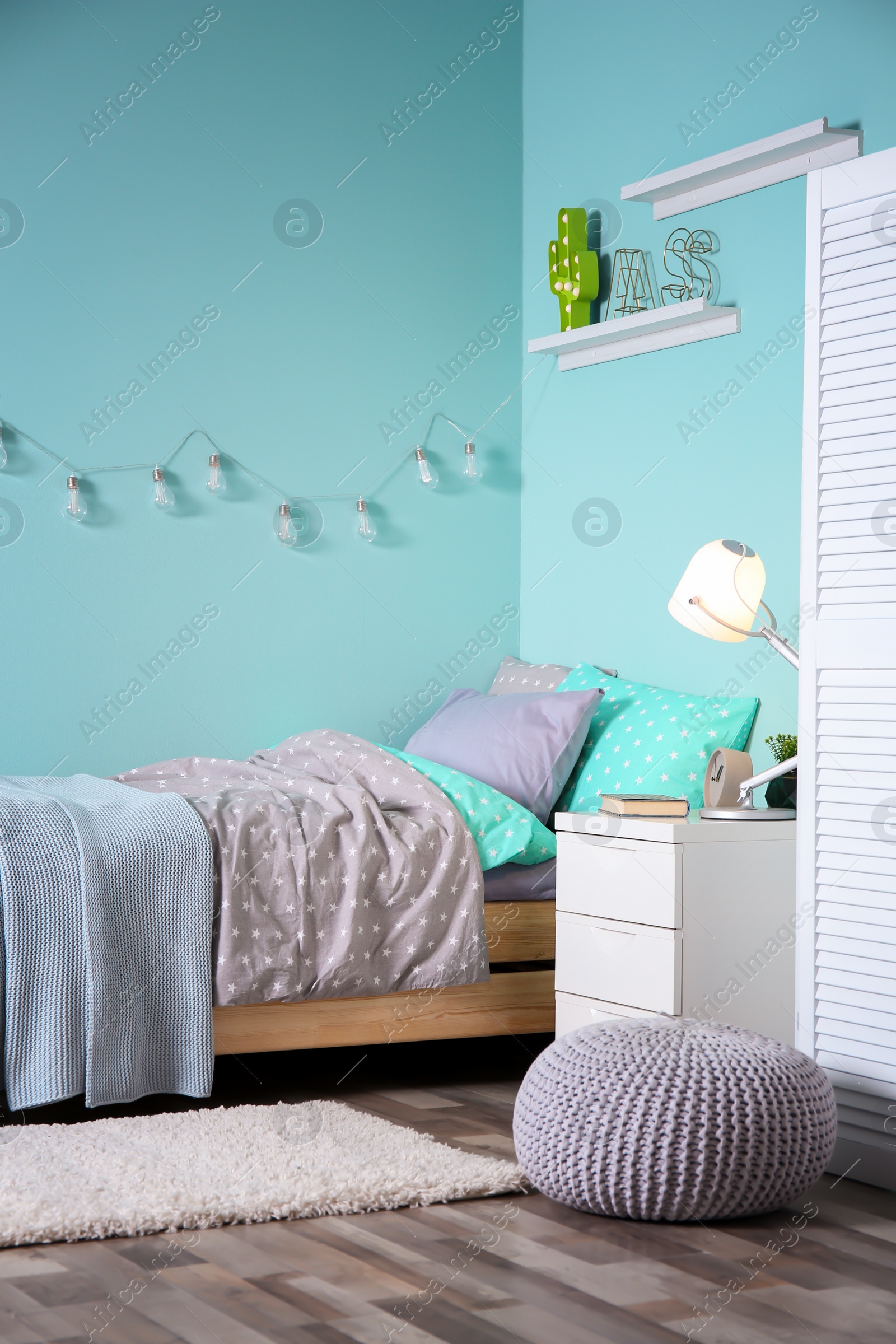 Photo of Comfortable bed in modern children room