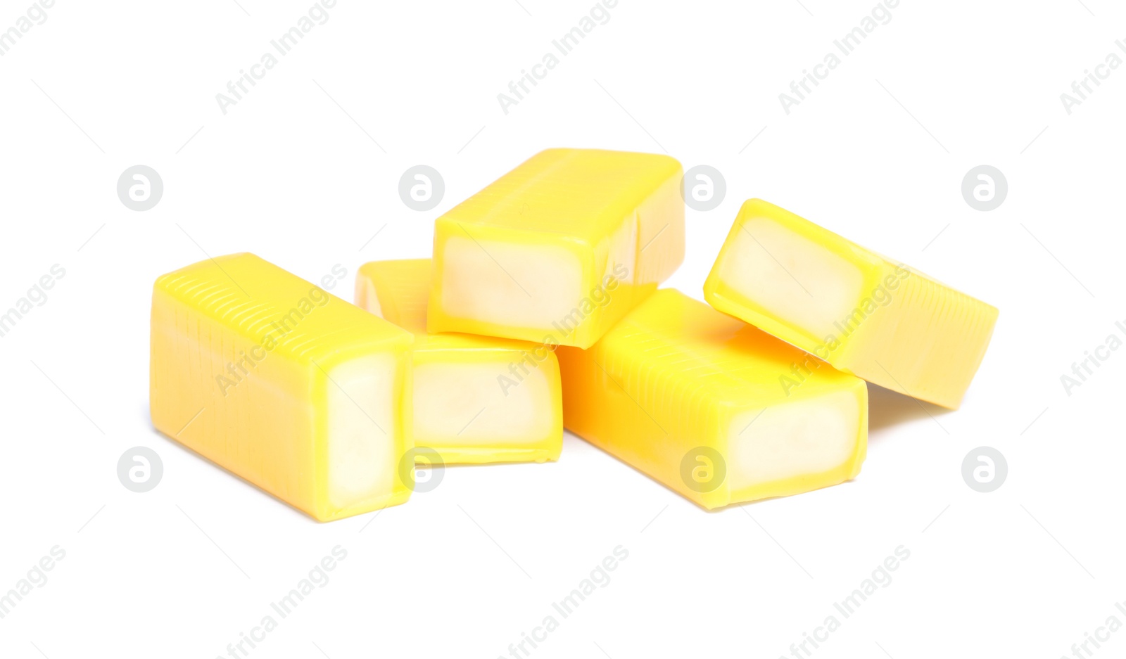 Photo of Tasty yellow bubble gums isolated on white