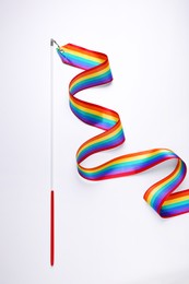 Rainbow gymnastics ribbon on white background, top view. LGBT pride