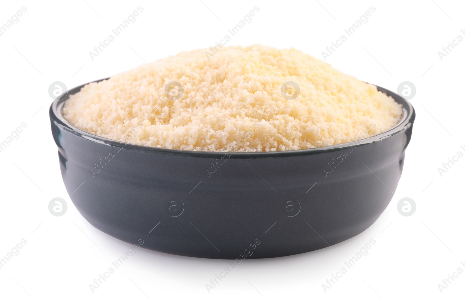 Photo of Delicious grated parmesan cheese in bowl isolated on white