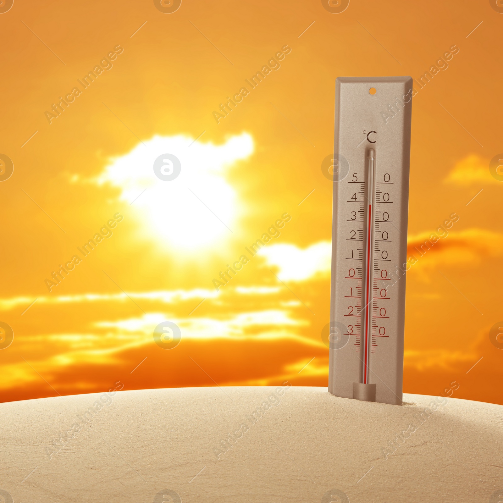 Image of Weather thermometer with high temperature outdoors on hot sunny day. Heat stroke warning