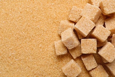 Photo of Refined and granulated brown sugar as background, closeup