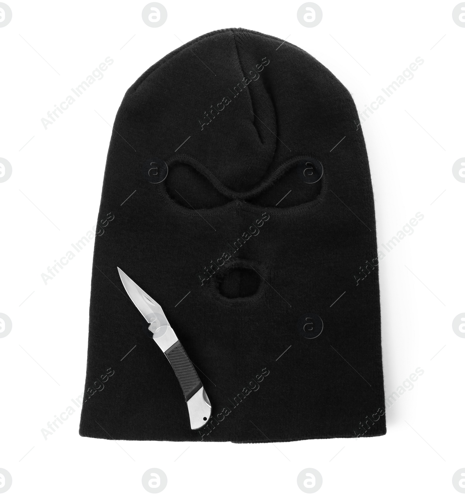 Photo of Black knitted balaclava and knife on white background, top view