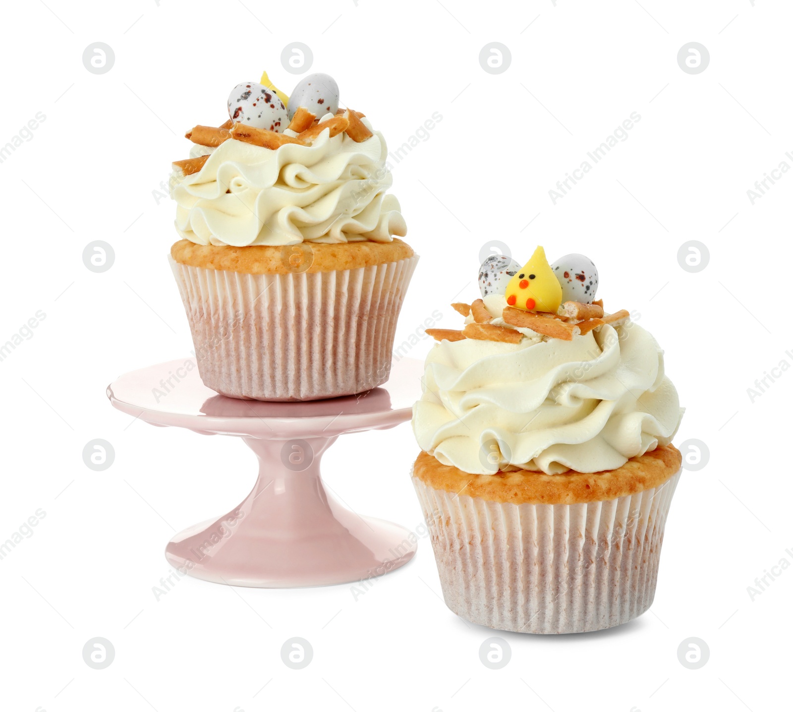 Photo of Tasty Easter cupcakes with vanilla cream isolated on white