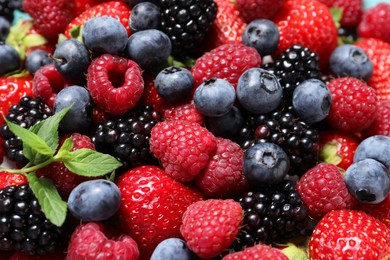 Many different fresh ripe berries as background, closeup