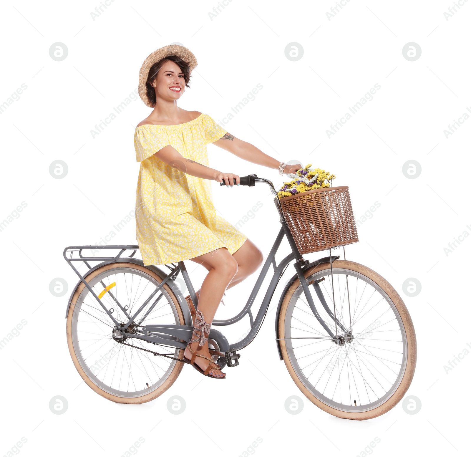 Photo of Portrait of beautiful young woman with bicycle on white background