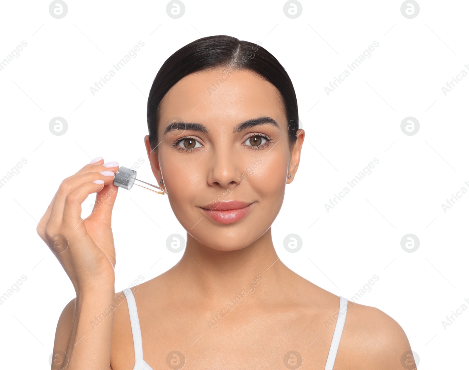 Photo of Young woman with dropper of essential oil on white background