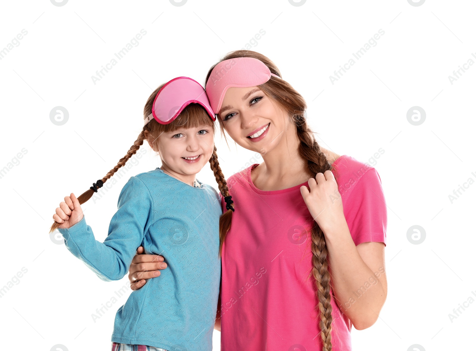 Photo of Happy woman and daughter in pajamas on white background