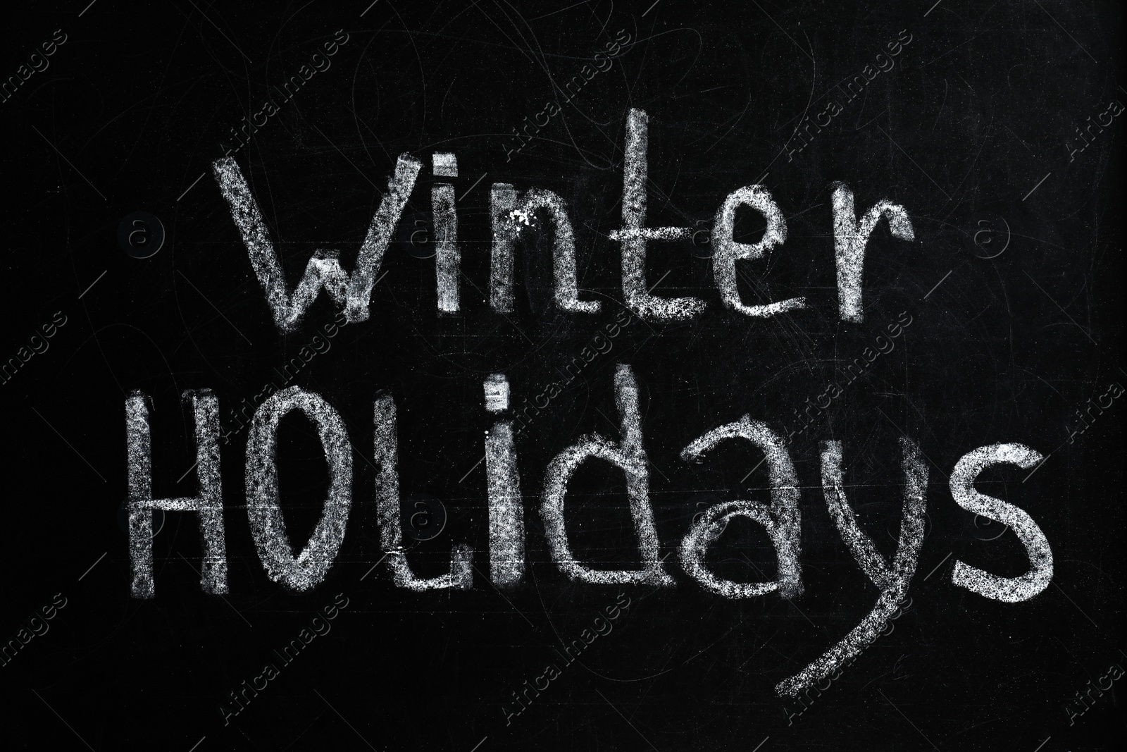 Photo of Phrase Winter Holidays written on black chalkboard