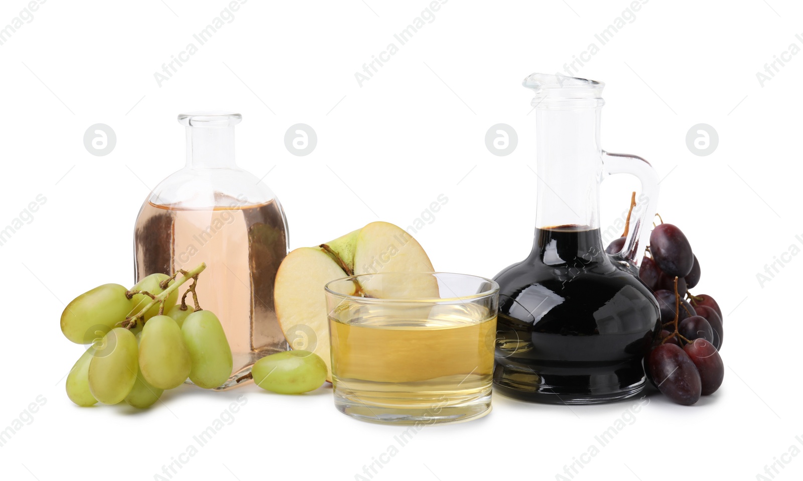 Photo of Different types of vinegar and ingredients isolated on white