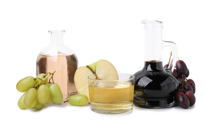 Photo of Different types of vinegar and ingredients isolated on white