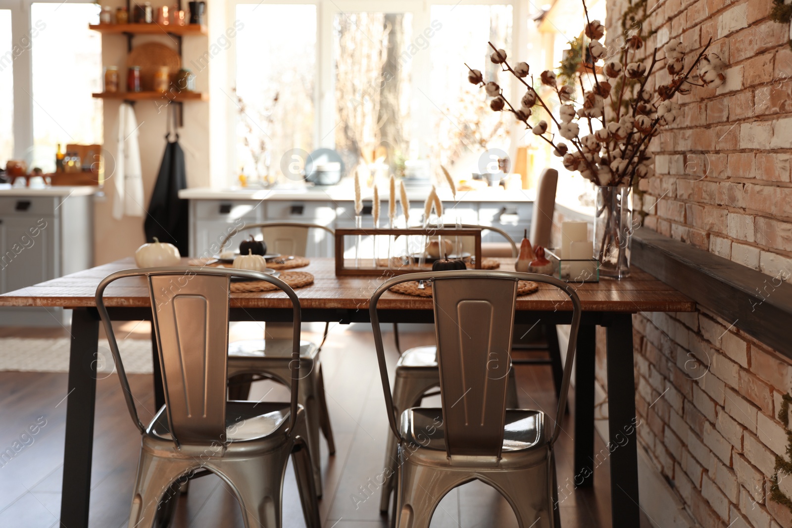 Photo of Stylish kitchen interior with dining table and chairs