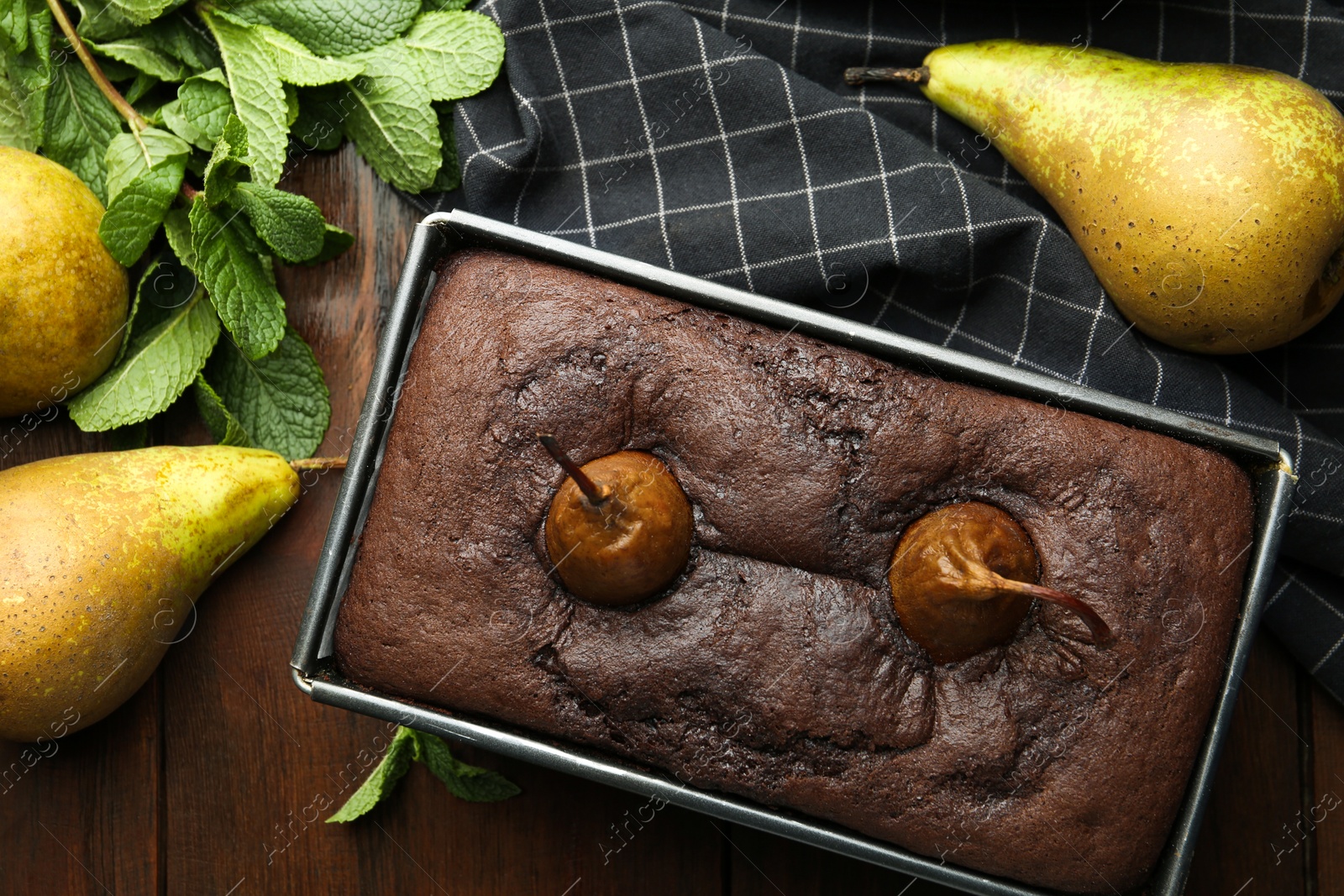 Photo of Flat lay composition with tasty pear bread on wooden table. Homemade cake