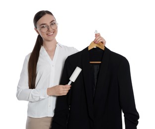 Photo of Young woman cleaning suit with lint roller on white background