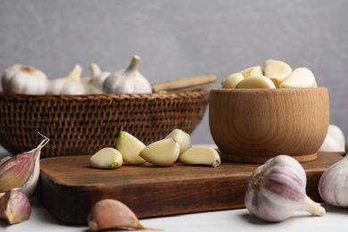 Photo of Fresh ripe garlic on white table. Organic product