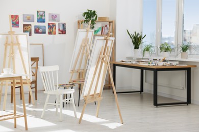 Photo of Stylish artist's studio interior with easels. Creative hobby