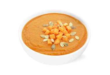 Photo of Delicious pumpkin cream soup with seeds in bowl isolated on white