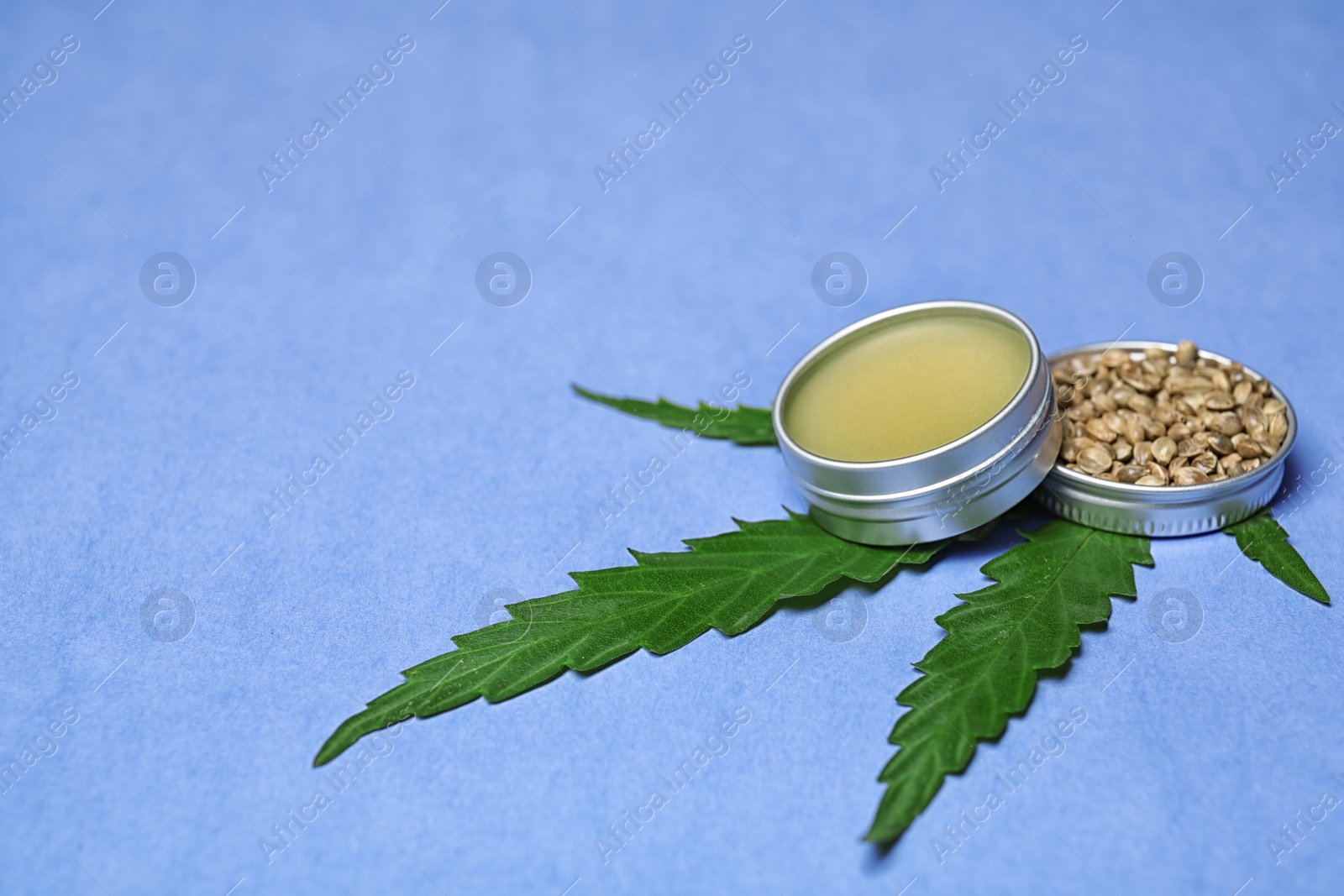 Photo of Composition with hemp lotion and space for text on color background