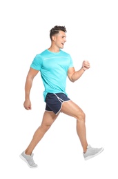 Handsome young man running on white background