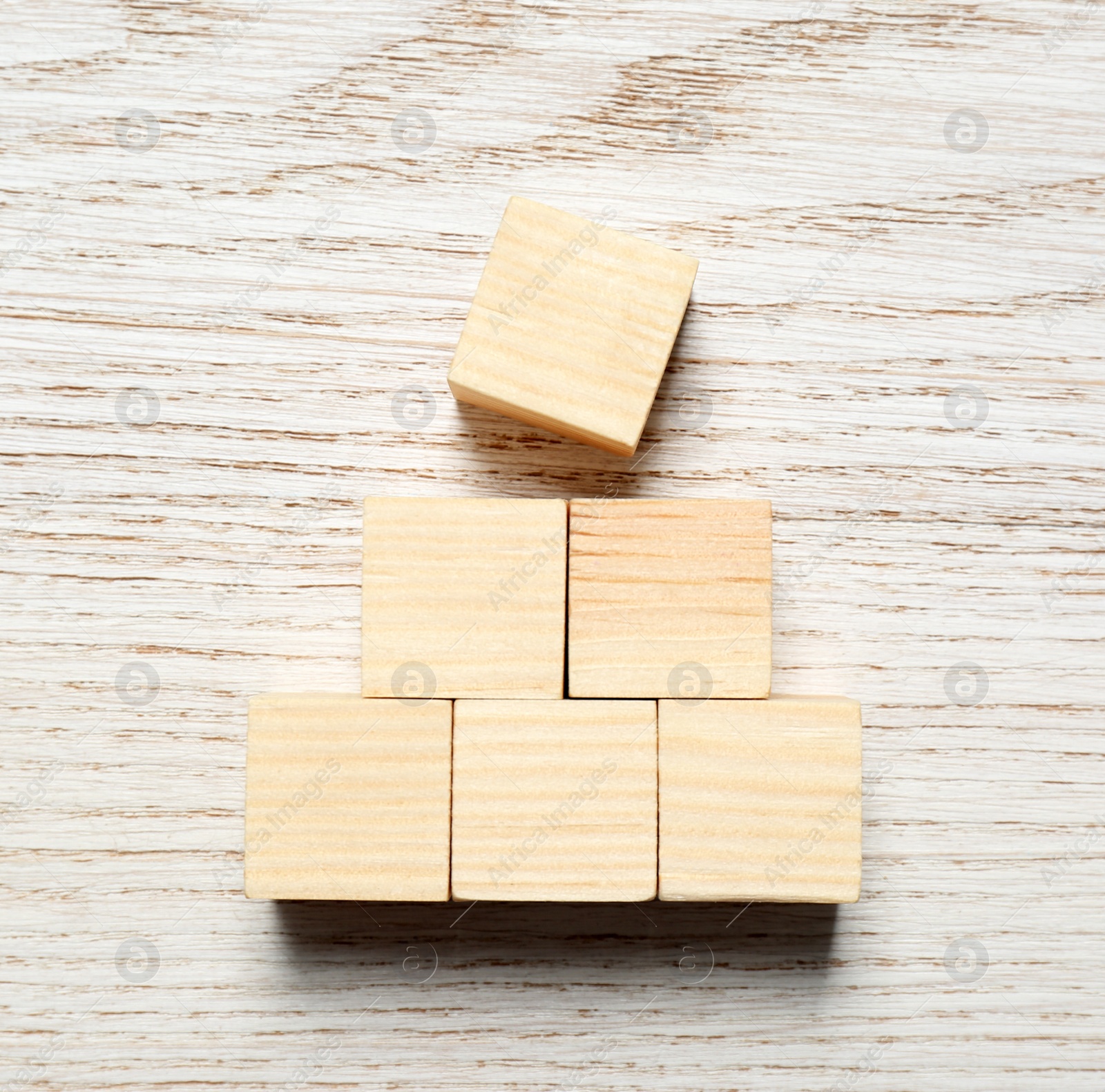 Photo of Blank cubes on white wooden table, flat lay with space for text. Idea concept