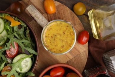 Photo of Tasty vinegar based sauce (Vinaigrette), salad and products on wooden table, flat lay