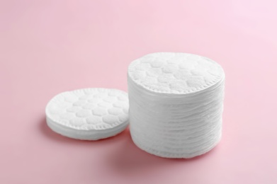 Photo of Cotton pads on color background. Space for text